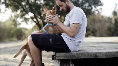 Warm-hugs-to-indie-hound-puppy-during-leash-walks-with-hispanic-owner