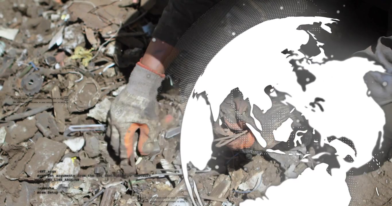 Close view starting sorting by gloved hand through scrap metal under globe graphic for recycling