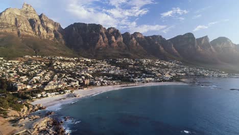 houses and mountain ranges along the sea coast 4k
