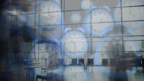 animation of blue digital clocks over time-lapse of people walking in office