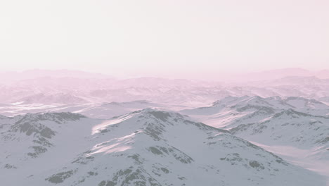 snow-capped mountains in a pink sunset