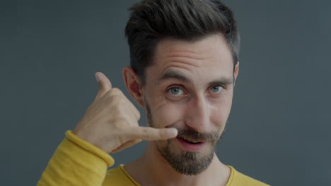 man making phone gesture