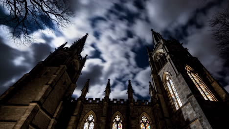 gothic church at night with time-lapse clouds