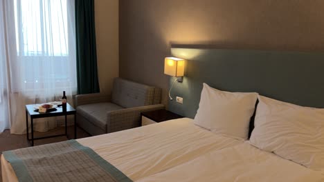 panning shot of the interior of a cozy hotel room in a spa resort