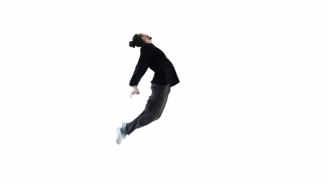 Energetic Young Man Performing Contemporary Dance Moves in Studio