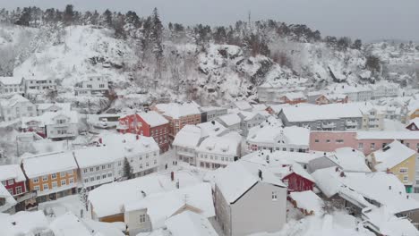 kragero, telemark county, norway - a delightful town adorned with a blanket of snow on a wintry day - orbit drone shot