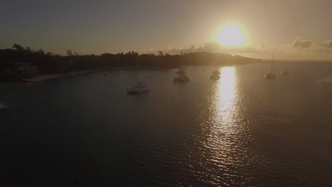 aerial view of yachts in bay of mauritius at sunset