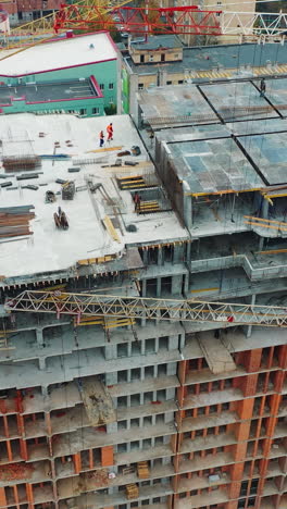 construction of a residential apartment complex. aerial view. vertical video