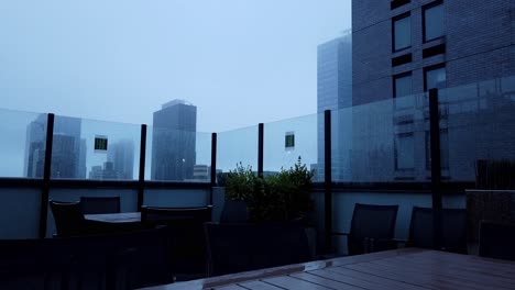 time lapse shot of sunrise with fog from a roof garden in new york city