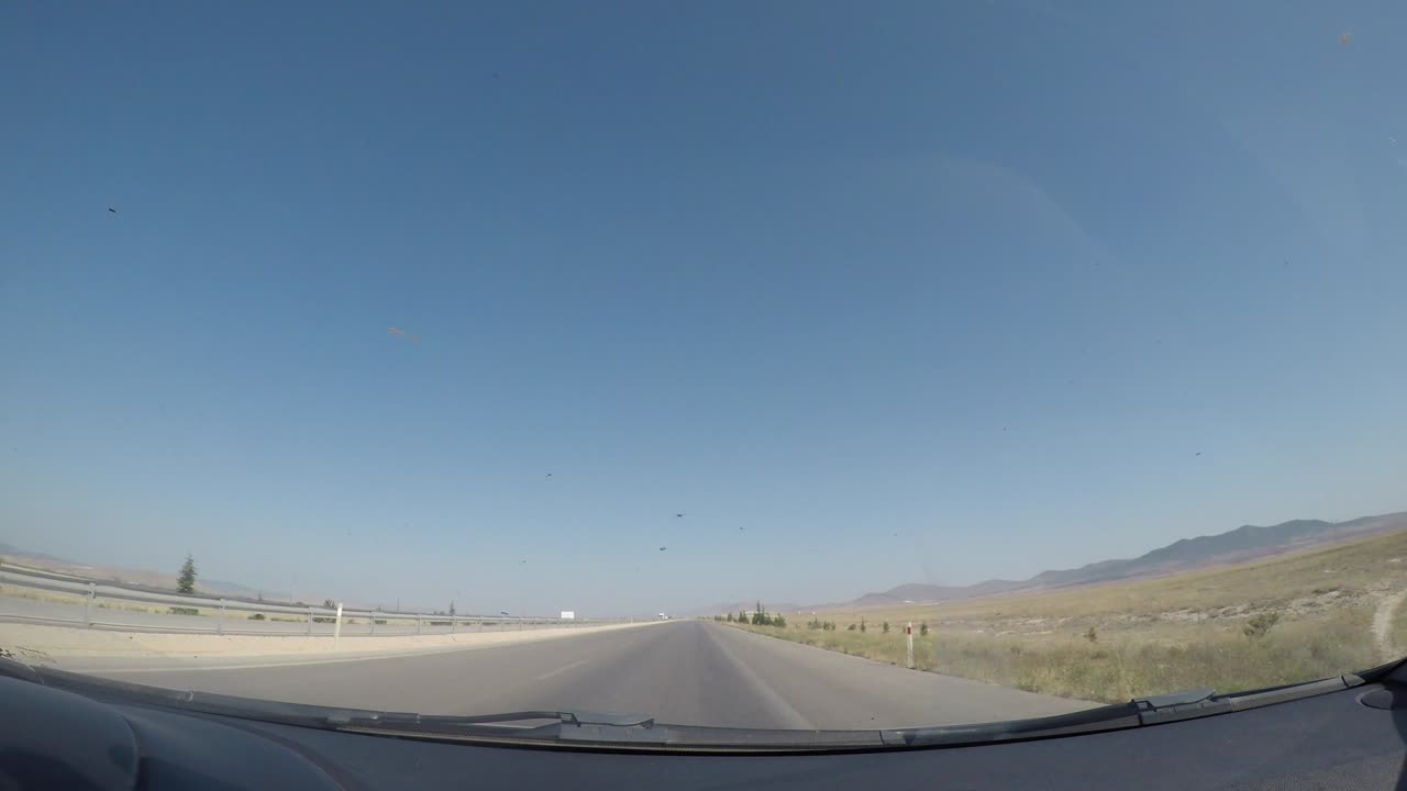 City, nature and traffic view from the camera inside the vehicle.