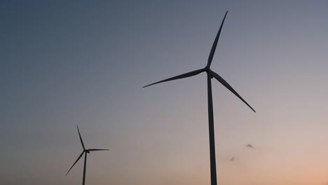 Wind-Turbines-Silhouette-against-the-Blue-sky-during-Sunset,-clean-alternative-energy-in-Thailand-and-mainland-Southeast-Asia