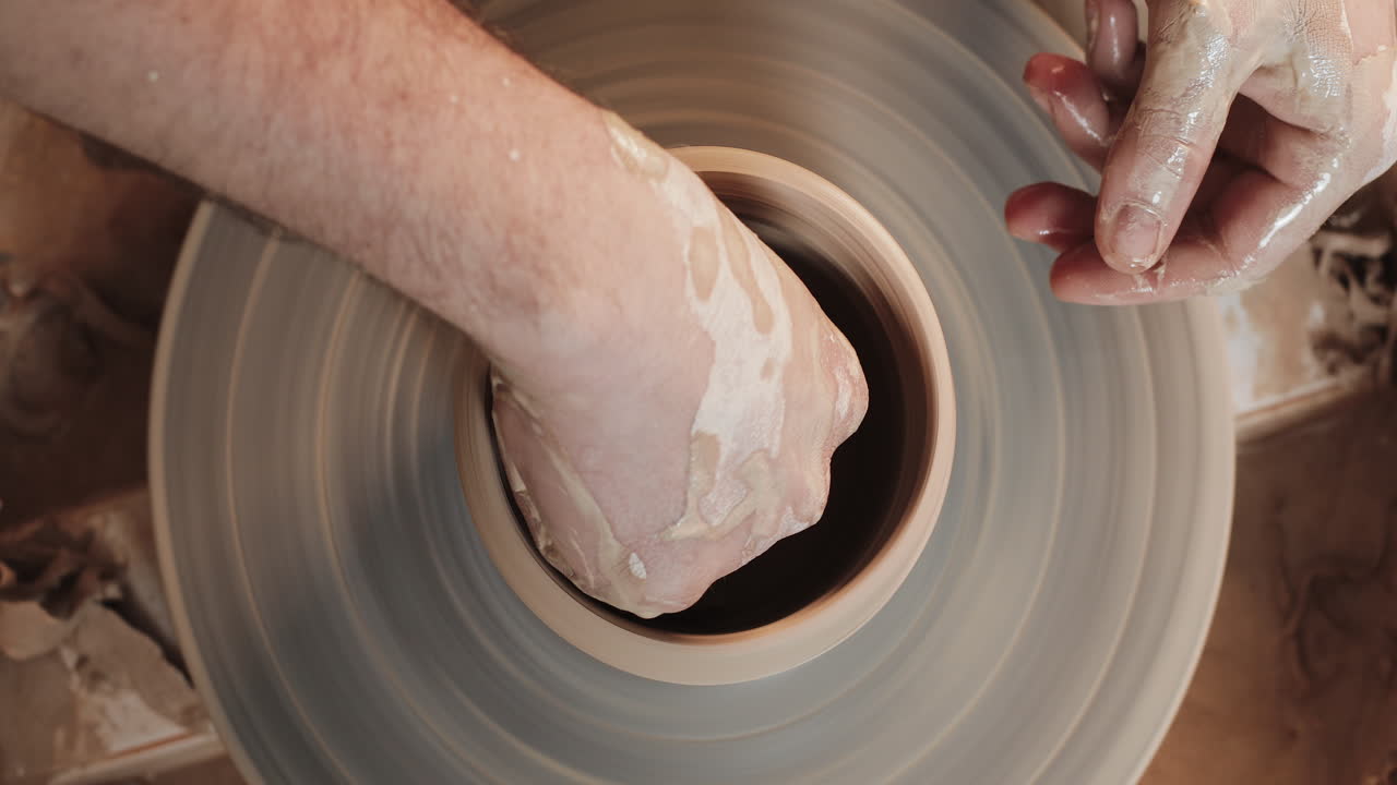 Pottery making process using a pottery wheel