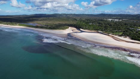 belongil creek on the public beach of belongil near byron bay, new south wales, australia