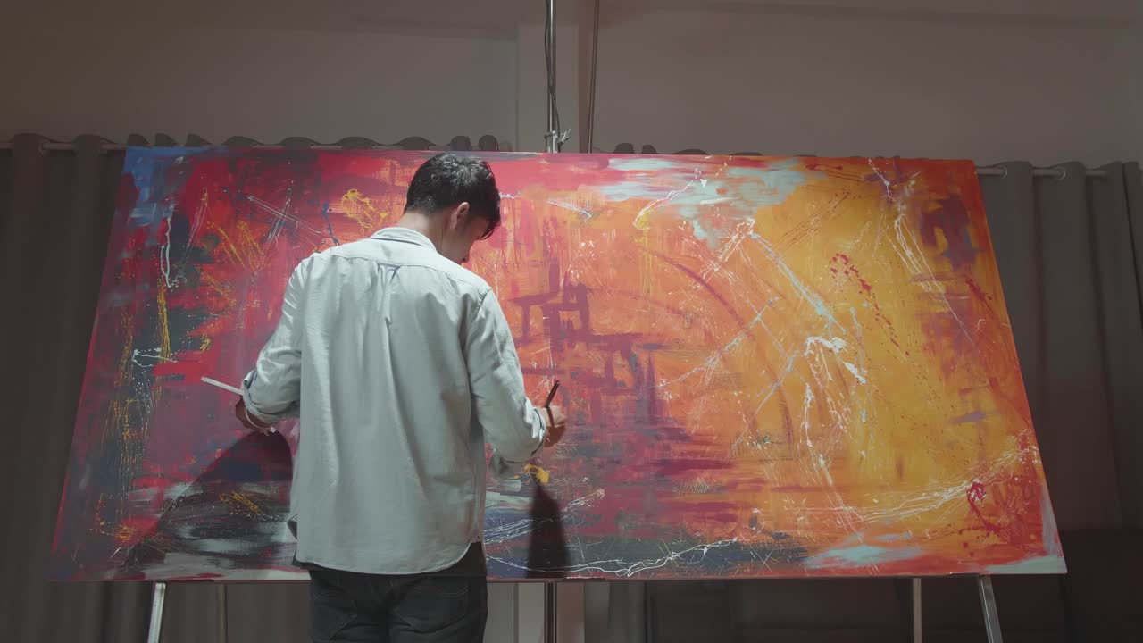 Artist Working On Abstract Painting At Home