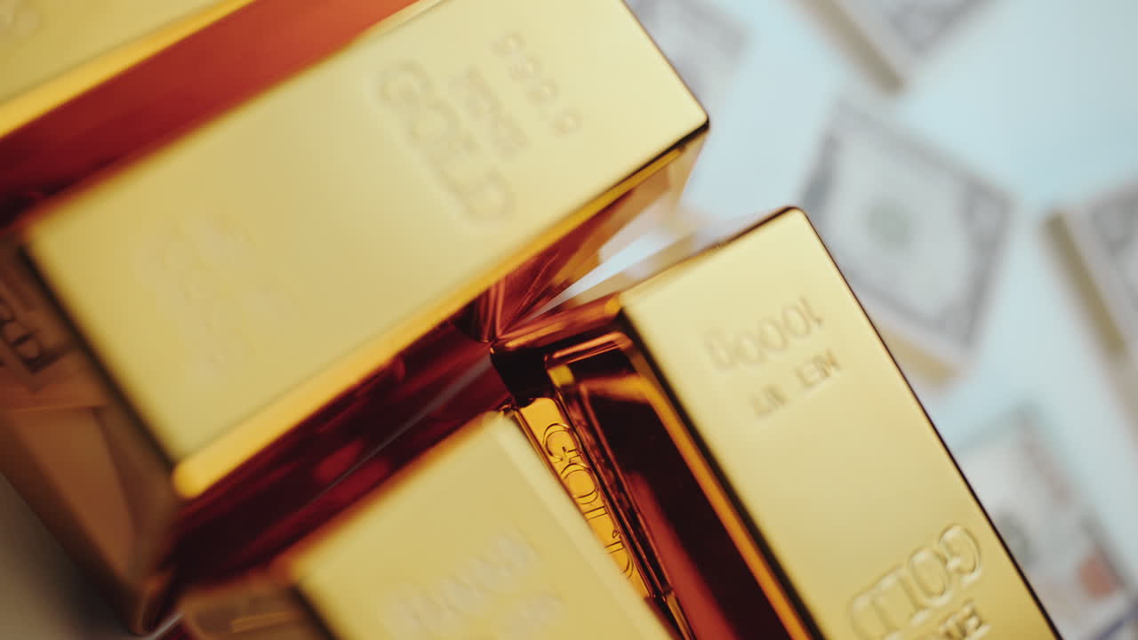 Stack of gold ingots on dollar bills