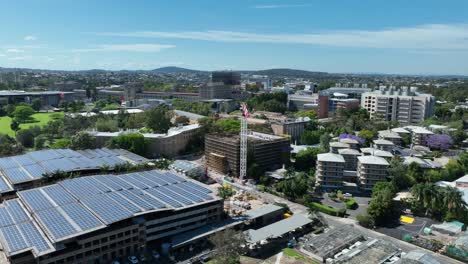 Drone-rotational-shot-of-construction-site-crane-working-on-on-Brisbanes-University-of-Queensland-UQ-campus