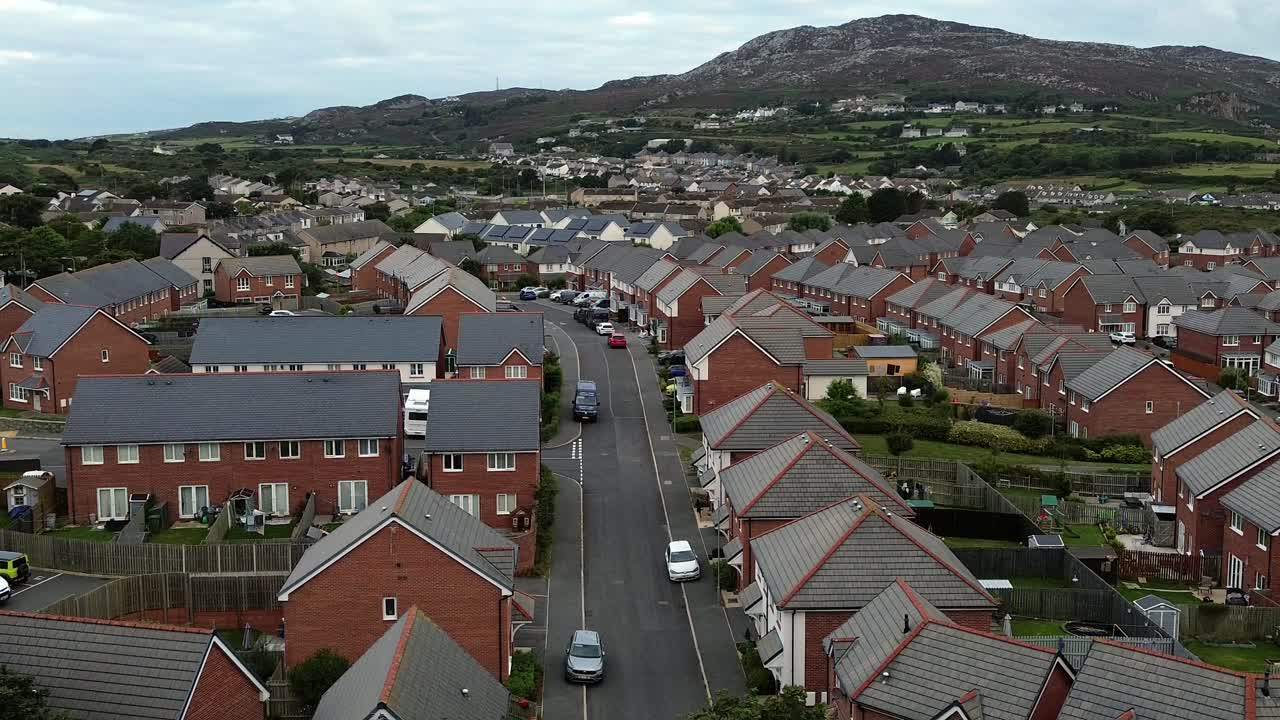 Holyhead homes aerial view over peaceful early morning residential housing and Welsh mountain