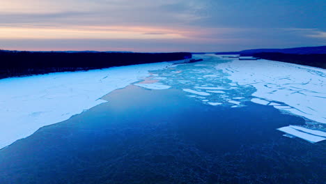 a video shot by a drone as it hovers above the expanse of ice chunks in water