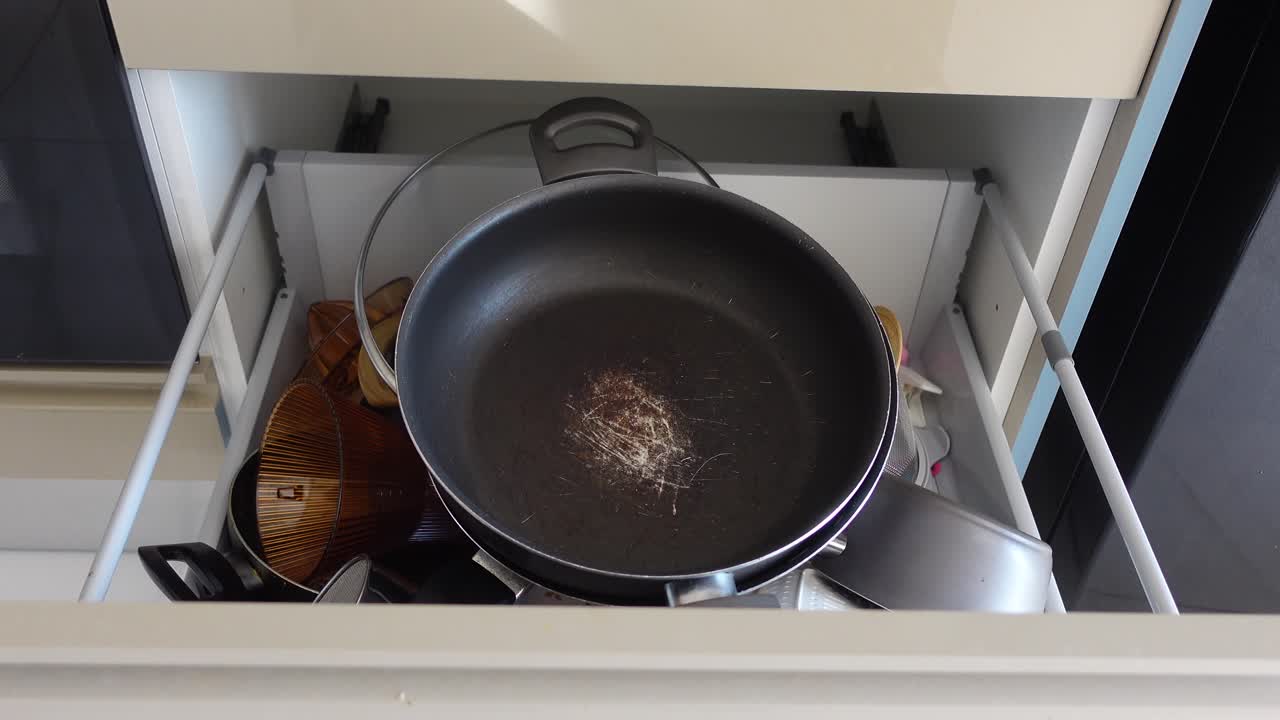 Kitchen Drawer with Utensils and Pans