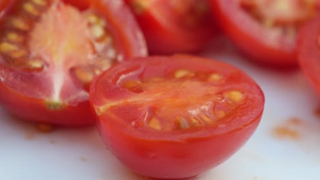 closeup of sliced tomatoes with fork