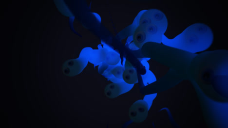 underwater wildlife. close-up animation of a group of many blue, translucent worms or tadpoles or sperm cells spawning from one spot and actively crawling forward.