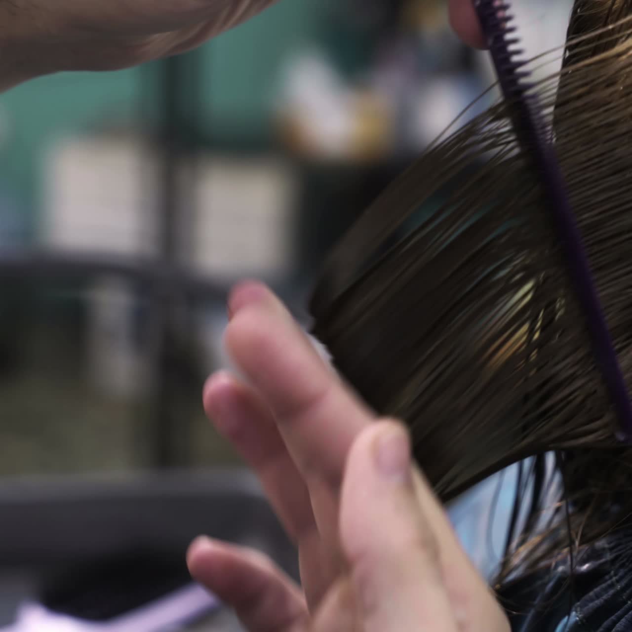 Professional stylist working with client