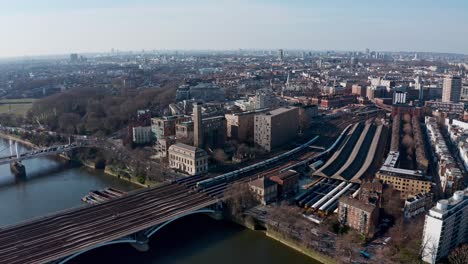 Cinematic-circling-aerial-Drone-shot-of-Grosvenor-road-and-railway-bridge-London