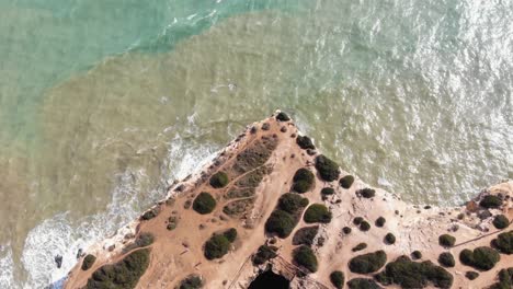 Top-view-of-Benagil-Cave-and-Atlantic-sea-beach,-Lagoa,-Algarve,-Portugal