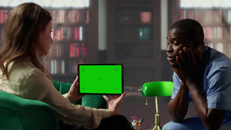 counseling session with green screen tablet