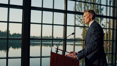 Businessman Giving a Speech by the Lake