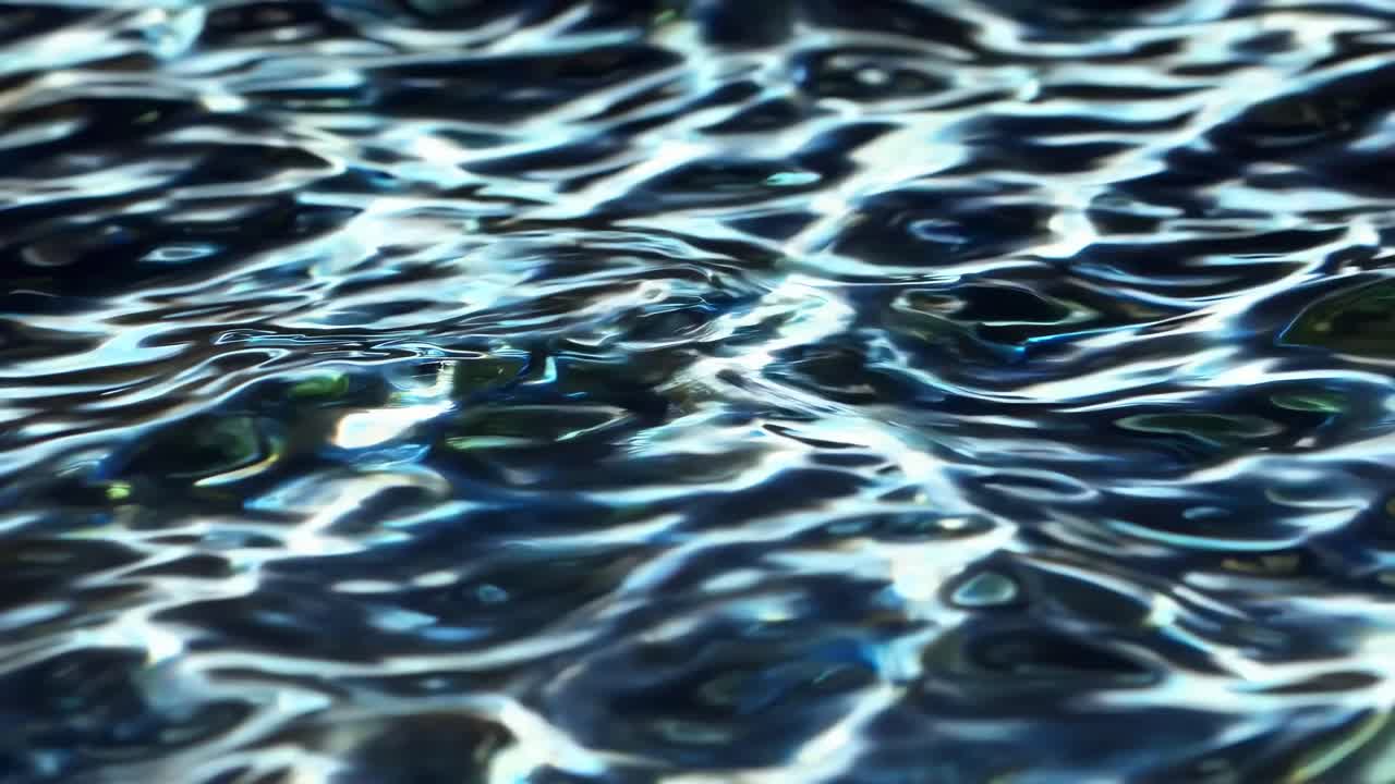 The video captures the mesmerizing movement of water with a focus on light reflections