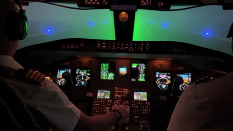 jet cockpit view looking fordward during a taxi-out during the night with heavy for conditions