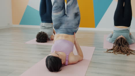yoga class with legs up pose