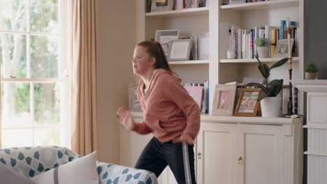 happy teenage girl dancing at home having fun celebrating with cool dance moves enjoying freedom on weekend 4k