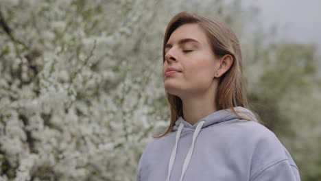 woman wearing mask outdoors in spring