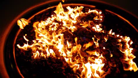 close-up of a fiery fire pit at night
