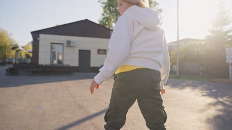 boy skateboarding and running outdoors