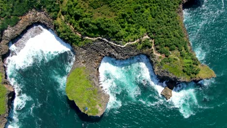 majestic cliff shoreline of java, indonesia, kesirat beach aerial top view