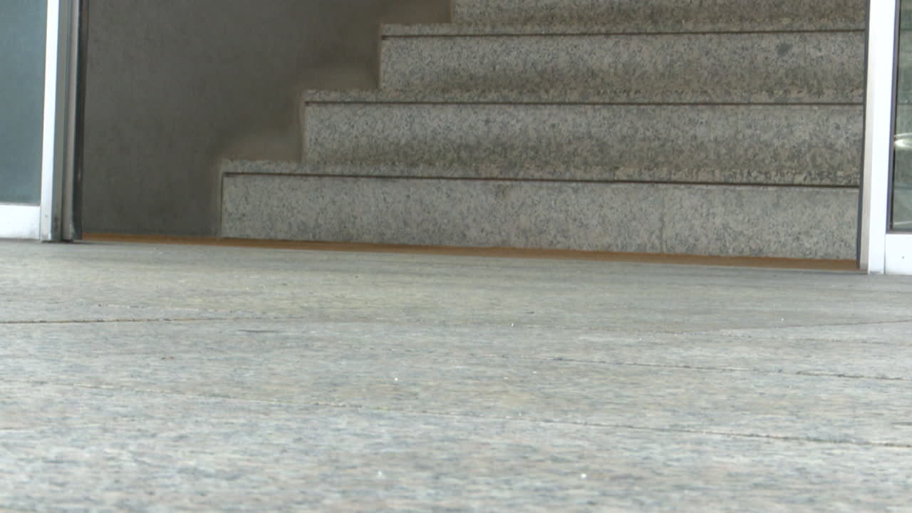 Exterior Building Entrance with Steps and Sliding Doors