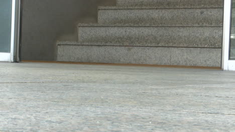 exterior building entrance with steps and sliding doors