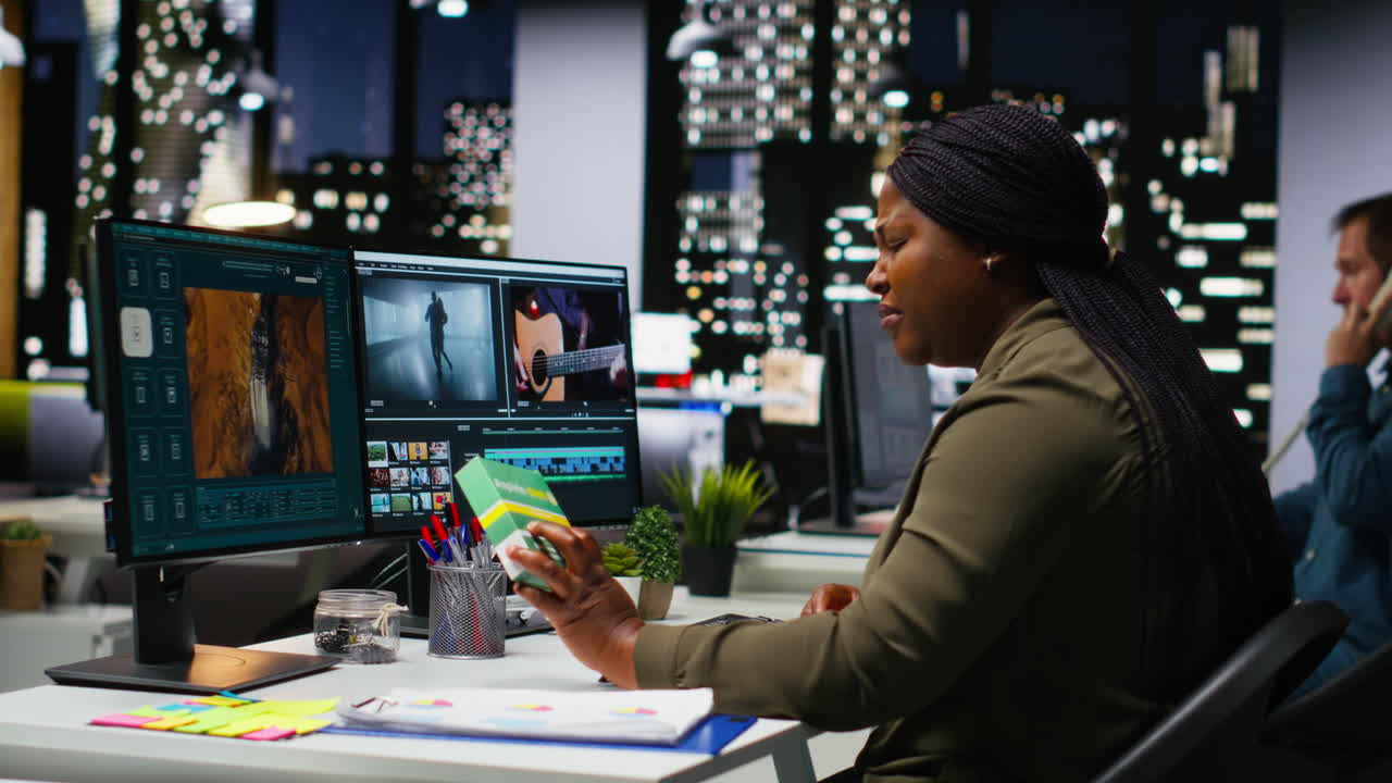 Female editor taking a painkiller to calm her severe headache