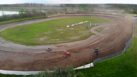 4k drone video of sprint car racing at mitchell raceway in fairbanks, ak during sunny summer evening-9