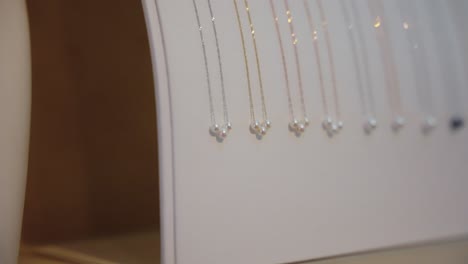 white and black pearl necklaces, gold and silver chains 4k