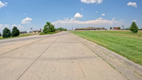 scenic roadside view with shops and greenery