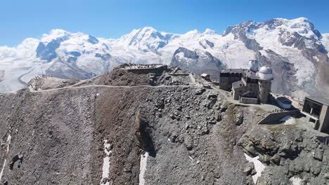 Flight-towards-the-observatory-at-Gornergrat,-Swiss-Alps-mountains-in,-Zermatt,-Switzerland