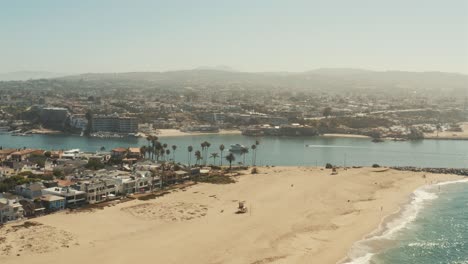 beautiful aerial drone of california coastal beach with boats in the harbor - graded