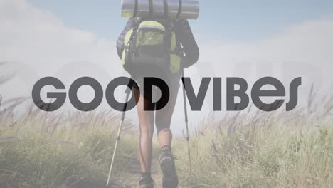 animation of the words good vibes in black over woman hiking in countryside