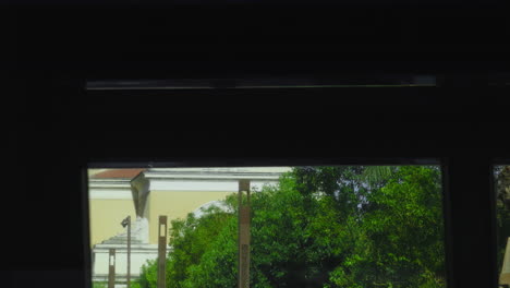 bus window view of cityscape