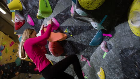 Teenage-girl-bouldering-indoors