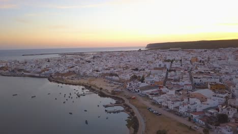 aerial view of the bautiful fishing town of barbate in cadiz with the sunset behind.
